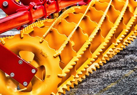 Close up of new yellow agricultural connection machine for tractorの写真素材