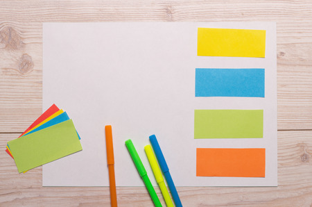 Group of markers and colorful note papers on wooden desk. Education and creativity conceptの写真素材