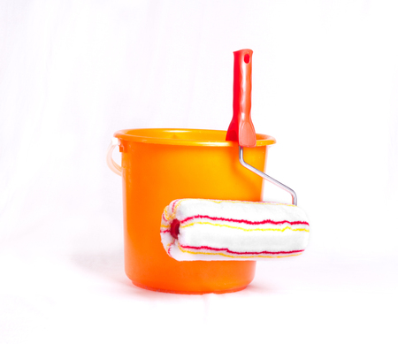 Roller brush and bucket for painting wall isolated on backgroundの写真素材