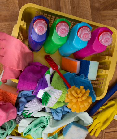 Top view of cleaning supplies and tools on the parquet. House cleaning service conceptの写真素材