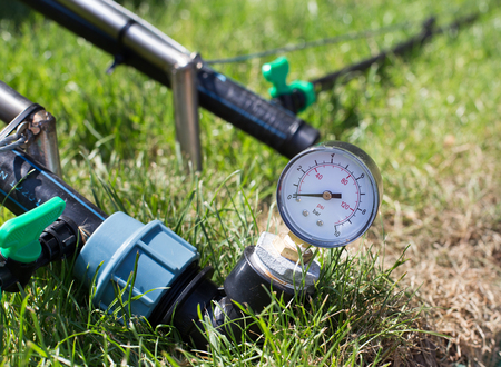 Close up of pressure equipment for irrigating grasslandの写真素材