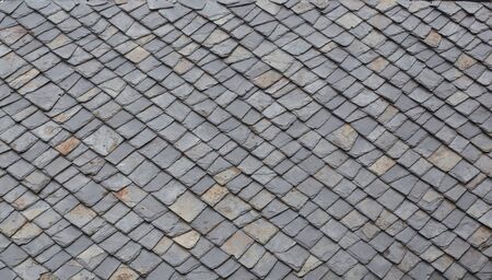Close up of stone tiles on traditional shingles roof in Mokra Gora in Serbiaの写真素材
