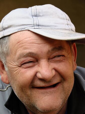 an older funny man with a cap                            の写真素材