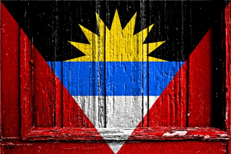 flag of Antigua and Barbuda painted on wooden frameの写真素材