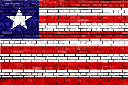 flag of Liberia painted on brick wallの写真素材