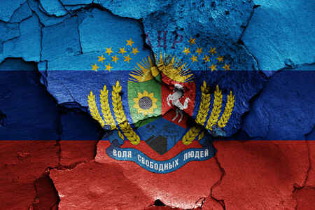 flag of Lugansk Peoples Republic painted on cracked wallの写真素材