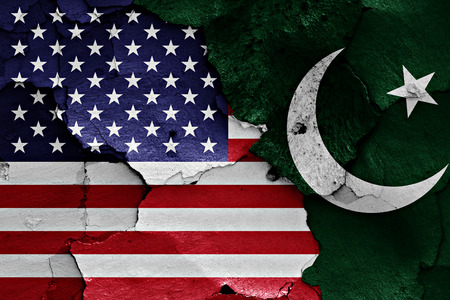 flags of USA and Pakistan painted on cracked wall
