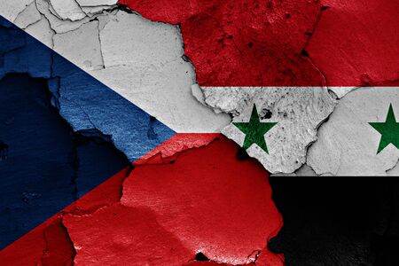 flags of Czech Republic and Syria painted on cracked wallの写真素材