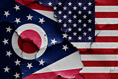 flags of Ohio and USA painted on cracked wall