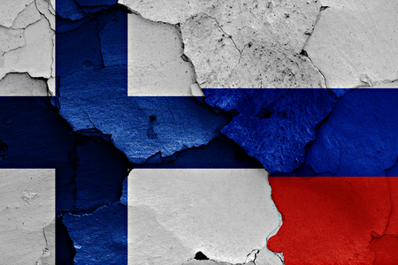 flags of Finland and Russia painted on cracked wallの写真素材