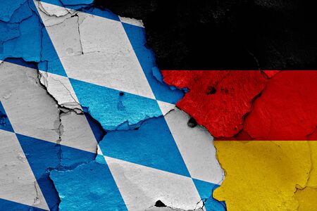 flags of Bavaria and Germany painted on cracked wallの写真素材