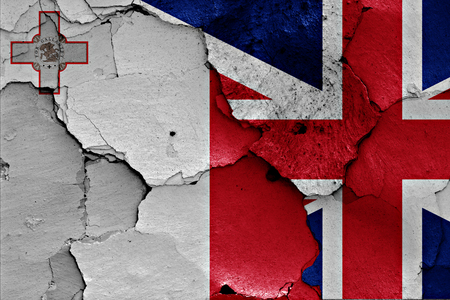 flags of Malta and UK painted on cracked wallの写真素材