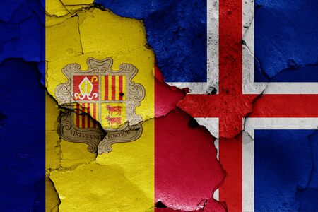 flags of Andorra and Iceland painted on cracked wallの写真素材