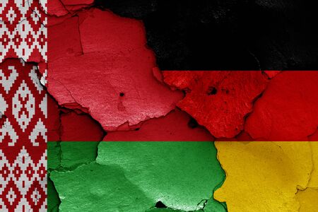 flags of Belarus and Germany painted on cracked wallの写真素材