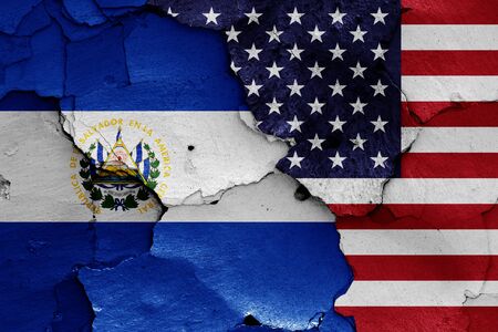 flags of El Salvador and USA painted on cracked wallの写真素材