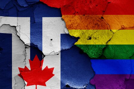 flags of Toronto and LGBT painted on cracked wallの写真素材