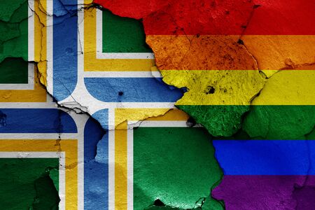 flags of Portland and LGBT painted on cracked wallの写真素材