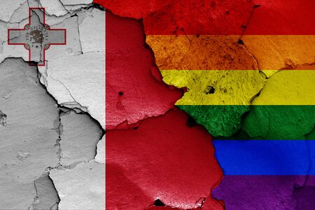flags of Malta and LGBT painted on cracked wallの写真素材