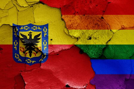 flags of Bogota and LGBT painted on cracked wallの写真素材