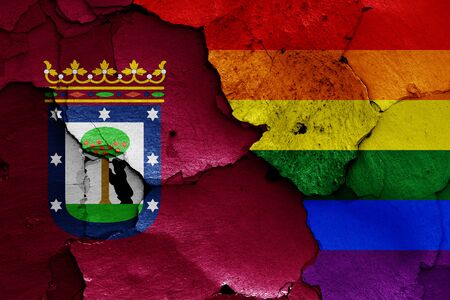 flags of Madrid and LGBT painted on cracked wallの写真素材