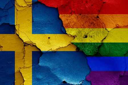 flags of Sweden and LGBT painted on cracked wallの写真素材