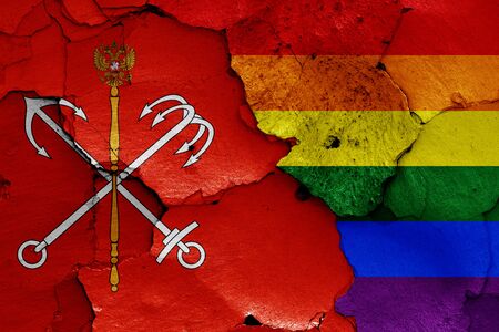 flags of Saint Petersburg and LGBT painted on cracked wallの写真素材