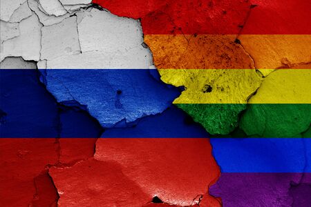 flags of Russia and LGBT painted on cracked wallの写真素材