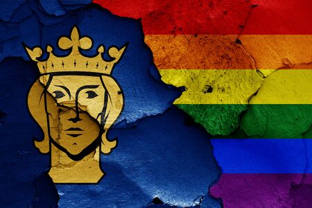 flags of Stockholm and LGBT painted on cracked wallの写真素材