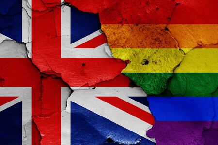flags of UK and LGBT painted on cracked wallの写真素材