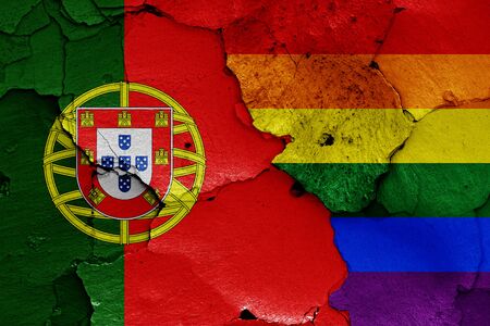 flags of Portugal and LGBT painted on cracked wallの写真素材
