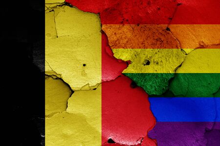 flags of Belgium and LGBT painted on cracked wallの写真素材