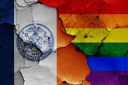 flags of New York City and LGBT painted on cracked wallの写真素材