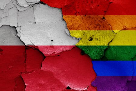 flags of Poland and LGBT painted on cracked wallの写真素材