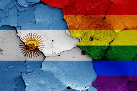 flags of Argentina and LGBT painted on cracked wallの写真素材