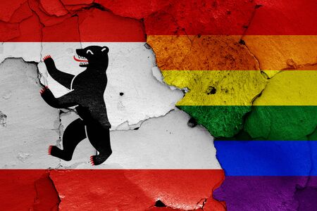 flags of Berlin and LGBT painted on cracked wallの写真素材
