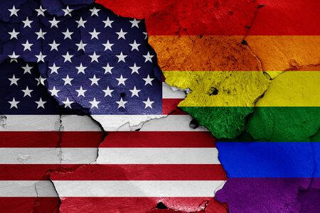 flags of USA and LGBT painted on cracked wallの写真素材