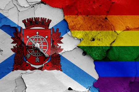 flags of Rio de Janeiro and LGBT painted on cracked wallの写真素材