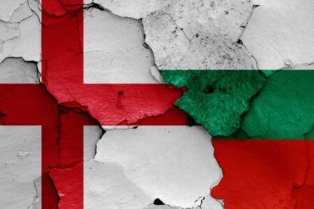 flags of England and Bulgaria painted on cracked wallの写真素材