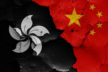 flags of Hong Kong and China painted on cracked wallの写真素材