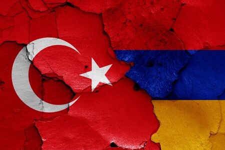 flags of Turkey and Armenia painted on cracked wallの写真素材