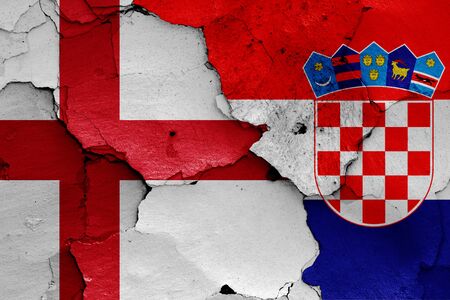 flags of England and Croatia painted on cracked wallの写真素材