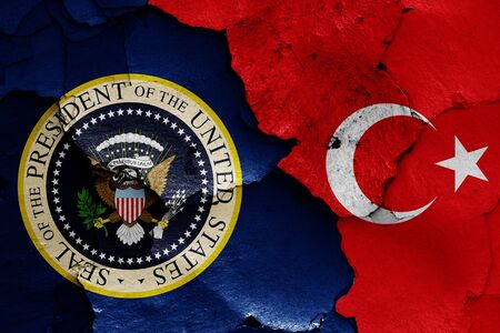 flags of President of the United States and Turkey painted on cracked wallの写真素材