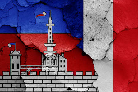 flags of Malakoff and France painted on cracked wallの写真素材