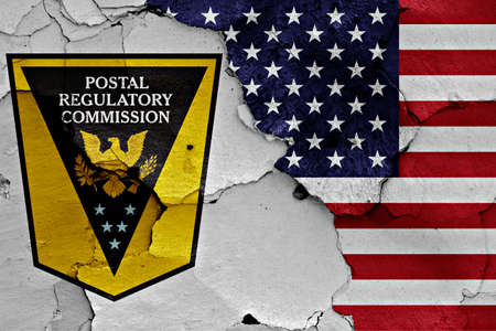 flags of Postal Regulatory Commission and USA painted on cracked wallの写真素材