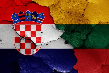 flags of Croatia and Lithuania painted on cracked wallの写真素材
