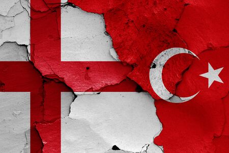 flags of England and Turkey painted on cracked wallの写真素材