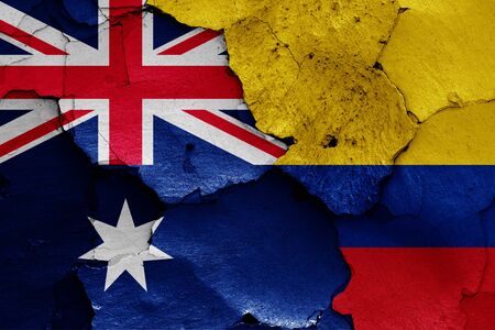 flags of Australia and Colombia painted on cracked wallの写真素材