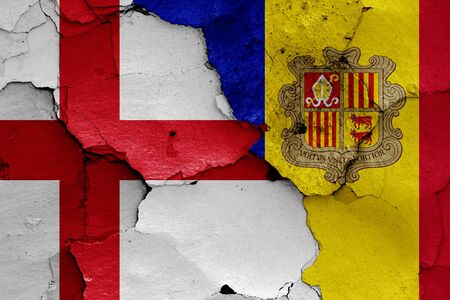 flags of England and Andorra painted on cracked wallの写真素材