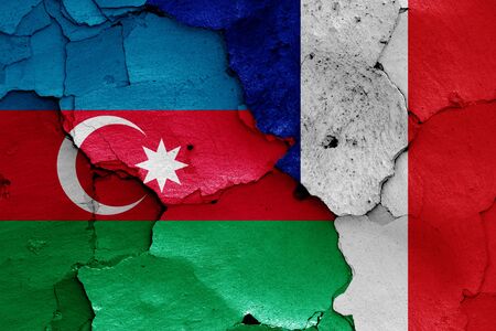 flags of Azerbaijan and France painted on cracked wallの写真素材