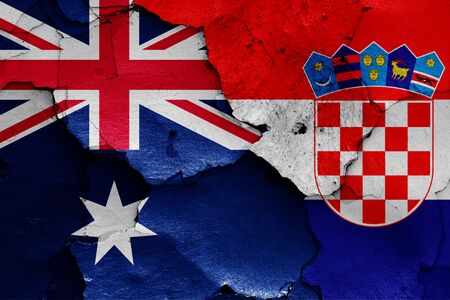 flags of Australia and Croatia painted on cracked wallの写真素材